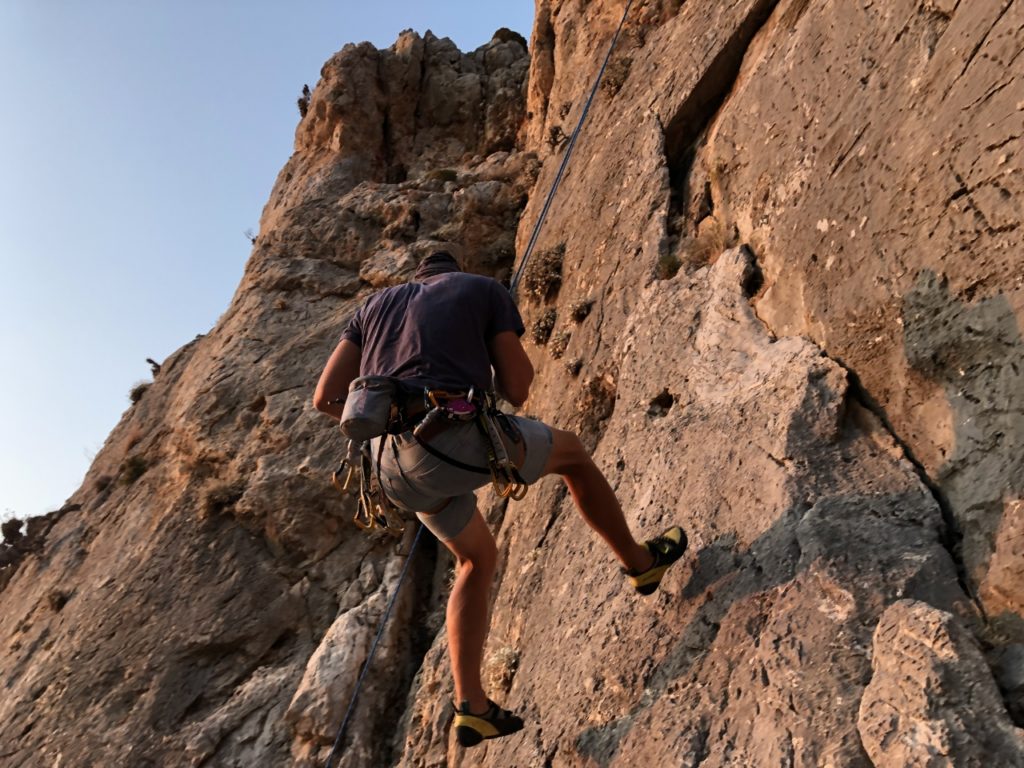 Climbing person on Kalymnos on the rock